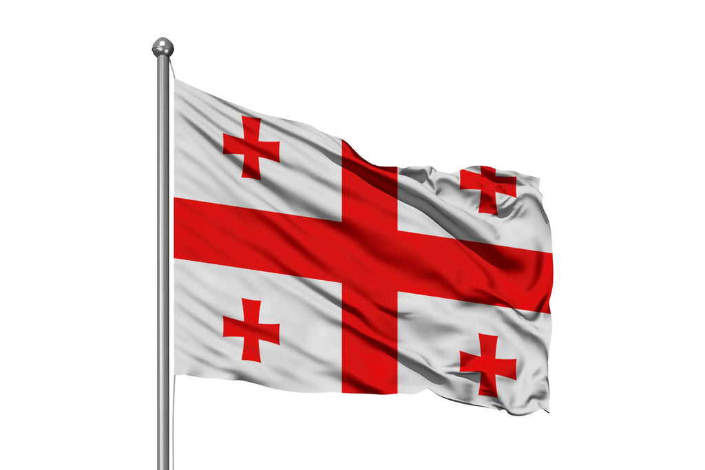 Georgia national flag with red cross and four smaller crosses on white, waving on flagpole